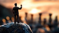 Silhouette of businessman standing on rock raising fist in triumph at sunset with blurred pier background symbolizing success achievement and leadership.