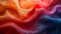 Flowing abstract waves in vibrant orange, red, and blue create dynamic motion effect with smooth gradients and curved lines, suitable for modern design backgrounds.