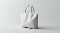 White canvas tote bag mockup on neutral background for branding and design projects. Eco-friendly shopping bag template for promotional merchandise.