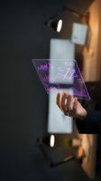 Hand holding transparent holographic tablet displaying purple financial charts, graphs and data analytics for business intelligence and digital technology concepts.