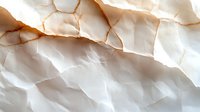Crumpled white paper with natural folds and shadows creating abstract textural pattern. Soft warm lighting highlights creases and wrinkles in minimalist composition.