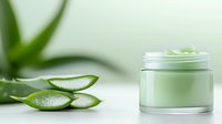 Fresh aloe vera leaves beside luxurious cosmetic cream jar on light background, natural skincare concept for beauty and wellness products.
