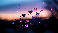 Glowing heart shapes floating against blurred sunset sky background with pink and purple sparkles creating romantic dreamy atmosphere for Valentine's Day designs.