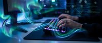 Hands typing on laptop keyboard with glowing digital data streams and futuristic interface elements for technology and cybersecurity concepts.