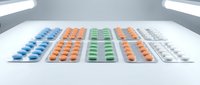 Colorful medication pills and capsules arranged in blister packs on white surface under bright lighting for pharmaceutical and healthcare concepts.
