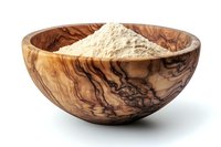 Organic wooden bowl with fine beige powder, showcasing natural grain patterns and rustic craftsmanship for culinary or wellness applications.