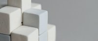 White and gray concrete cubes arranged in geometric composition for modern minimalist design and architectural visualization projects.