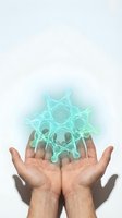 Open hands presenting glowing turquoise gear mechanism with electric energy effects for technology and innovation concepts.