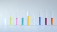 Laboratory test tubes with colorful liquid samples in row on light background, scientific research and chemical analysis concept for medical studies.