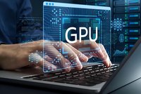 Professional man working on laptop with holographic GPU processor interface display for computing technology and artificial intelligence development.
