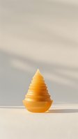 Yellow spiral pyramid-shaped object on beige background with soft shadow cast on wall, minimalist composition for modern interior design and decor.
