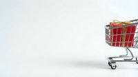 Shopping cart filled with red gift boxes on white background, isolated for retail and holiday commerce design use.