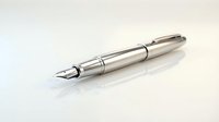 Elegant silver fountain pen with metallic finish on white background for business writing and professional correspondence.