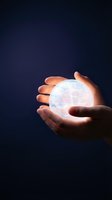 Hands holding glowing geometric sphere with network connections on dark blue background representing technology innovation and digital transformation.