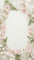 Soft pink cosmos and baby's breath floral frame on linen texture with copy space for wedding, greeting card or invitation design.