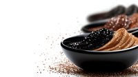 Black caviar served in elegant bowl with toast slices and scattered roe on white background for luxury dining and gourmet food presentations.