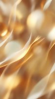 Smooth flowing waves of gold, cream, and amber create an elegant abstract background with soft bokeh effects for luxury design projects.