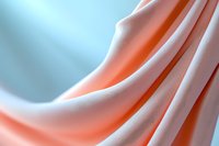 Soft flowing fabric in coral pink and white creates gentle waves and folds, showcasing elegant textile draping with smooth gradient transitions and delicate shadows.
