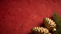 Festive gold pinecones with evergreen sprigs on deep red textured background, ideal for holiday and seasonal marketing materials.