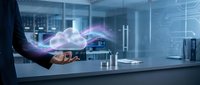 Businessman holding holographic cloud computing technology in modern data center server room with digital network connections and futuristic interface.