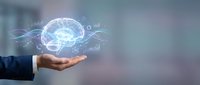 Businessman hand holding glowing digital brain with data visualization and neural network connections, representing artificial intelligence, machine learning, and innovative technology solutions.