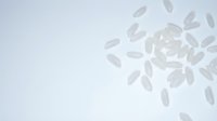 Scattered translucent white petals floating against a soft neutral background, suitable for wellness, spa, and cosmetic product marketing materials.