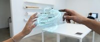 Futuristic holographic interface with hands interacting with transparent digital display showing voice recognition technology in modern office setting.
