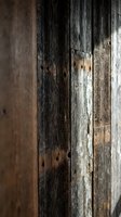 Weathered wooden planks with rustic texture and natural grain patterns for vintage interior design and construction projects.