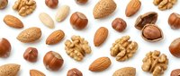 Mixed nuts collection with almonds walnuts hazelnuts on white background for healthy snacking cooking baking recipes nutrition wellness food design.