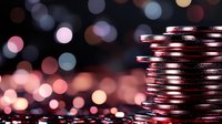 Stack of shiny silver coins on dark background with soft pink and blue bokeh lights creating magical financial atmosphere for business concepts.