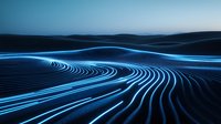 Glowing blue light trails curve across dark desert landscape creating futuristic pattern, abstract technology concept for digital transformation and innovation.