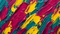 Abstract colorful paint strokes in vibrant pink, yellow and teal creating dynamic artistic texture for creative projects and modern design backgrounds.