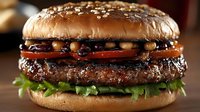 Gourmet burger with sesame seed bun, beef patty, caramelized onions, lettuce, and tomato slice. Perfect for restaurant menus, food blogs, and culinary marketing materials.