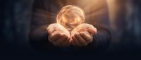 Hands holding glowing orb of light, symbolizing innovation, energy, and success for business, technology, and creative concepts.