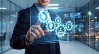 Professional businessman touching digital interface with glowing gears and technology icons in modern office environment for business automation concepts.