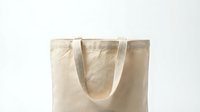 Blank natural linen tote bag with handles isolated on white background, ready for branding, printing, or merchandise design projects.