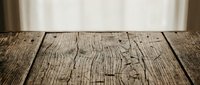 Rustic weathered wooden table surface with natural grain texture and vintage character for product display and design projects.