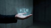 Business professional hand presenting glowing cybersecurity icons including shield, key and lock symbols representing data protection and digital security solutions.