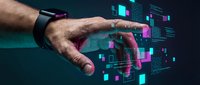 Male hand reaching toward holographic digital interface with colorful data visualization elements and futuristic technology display for business presentations.