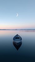 Serene wooden boat floating on calm lake at dawn with crescent moon in pastel sky. Peaceful morning reflection creates tranquil atmosphere for meditation concepts.