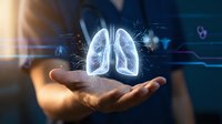 Medical professional holding holographic lungs projection with digital health data visualization for respiratory care and pulmonology concepts.