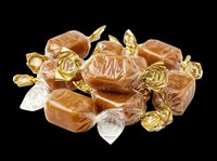Wrapped caramel candies pile isolated on transparent background, ready for stickers, t-shirt design, clipart, print on demand, and sublimation projects.