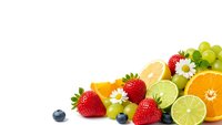 Fresh mixed fruits and berries with daisies on white background. Colorful assortment of strawberries, citrus, grapes and blueberries for healthy eating.