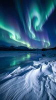 Spectacular northern lights aurora borealis dancing over frozen winter landscape with snow-covered mountains and icy terrain under starry night sky.