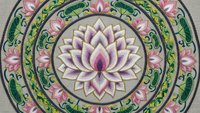 Ornate lotus mandala with intricate floral patterns in pink and green tones on textured background for meditation and spiritual design projects.