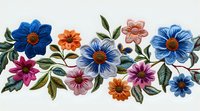 Colorful floral border with blue, orange, and pink flowers arranged in decorative pattern with green leaves on white background. Seamless horizontal design for fabric.