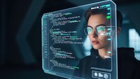 Young Asian woman software developer coding on futuristic holographic computer interface with programming code display for technology and innovation projects.