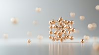 Metallic rose gold molecular structure model on light background with scattered spherical elements creating scientific composition with soft bokeh effect.
