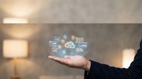 Businessman hand presenting holographic digital technology icons and symbols floating above palm in modern office environment for innovation concepts.