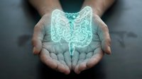 Hands protecting glowing digestive system hologram representing gut health, medical care, gastroenterology and intestinal wellness concept for healthcare design.
